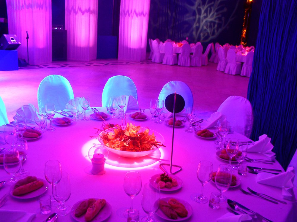 Reception tables with colored uplighting